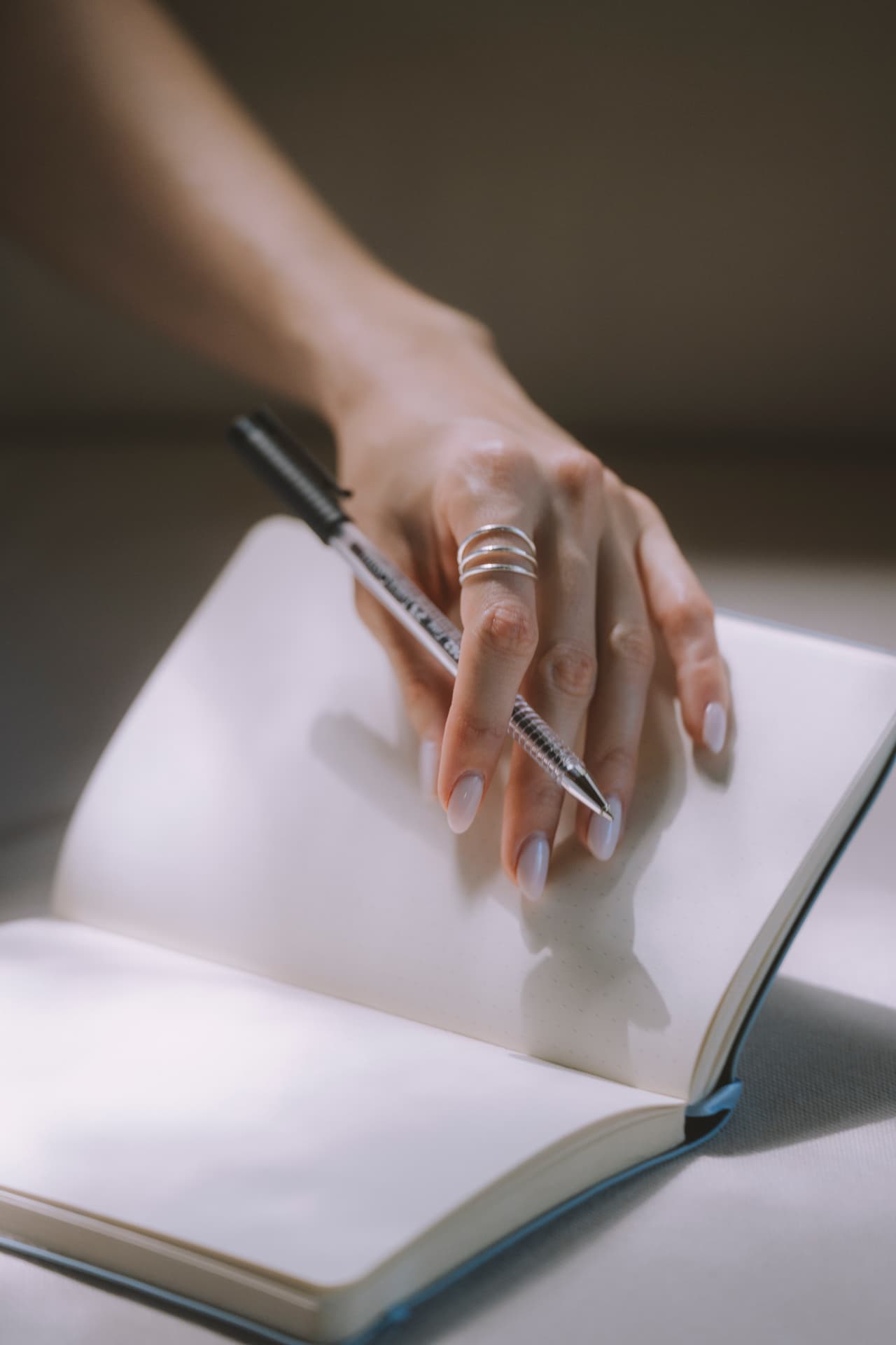 Hands writing in a notebook